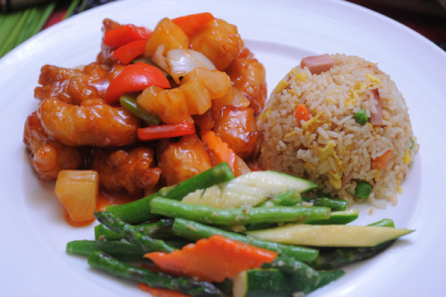 Lunch special with pork fried rice, vegetables, and sweet and sour prawns